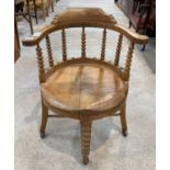 A 19th/20th century oak office chair, the bow back