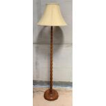 An early to mid-20th century teak standard lamp, o