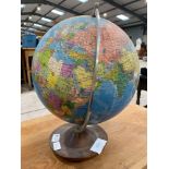 A vintage globe of the world (post 1964), on stain