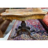 A Victorian burr walnut card table, the serpentine