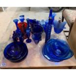 Collection of blue glassware including dishes, orn