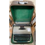 Vintage Remington 'Quiet Riter' typewriter in case.