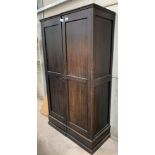 A Phillips & Sons stained oak 2 door wardrobe. Viewing/collection at West Woodland