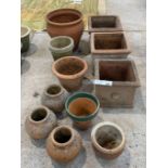 Collection of terracotta garden pots, various shapes.