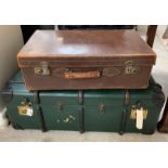 Large green leatherette trunk along with a vintage brown leather suitcase