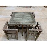 Weathered hard wood garden table & 4 corner chairs