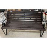 Wrought iron & stained wood garden bench.