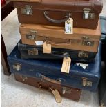 5 vintage leather suitcases.