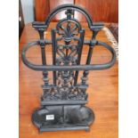 A black painted cast iron stick stand with removab