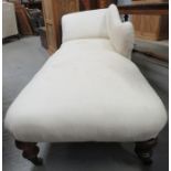 A Victorian chaise longue with shaped back and on