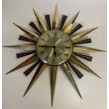 A Metamec sunburst wall clock in the 1960's style,