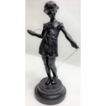 A 20th century Russian figure of standing girl wit