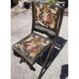 A 19th century folding chair with gilt decorated e