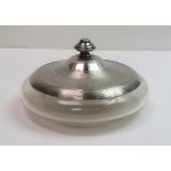 A glass powder bowl with silver rim and lift off c