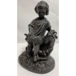 A spelter figure of a standing boy with a goat, 13