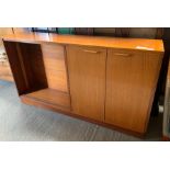 A teak side cabinet with open area for shelves and