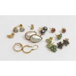 **WITHDRAWN** A collection of nine pairs of earrings, some stone