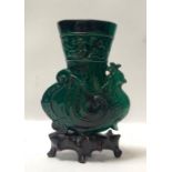 A Chinese carved malachite vase worked in the form