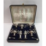 A cased seven piece silver cruet set, by A. J. Bai