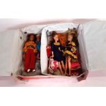 Four Pippa dolls in red vinyl case and with various clothing