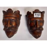 A pair of carved oak embellishments in the form of