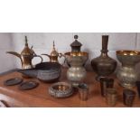 A collection of middle eastern brass items includi