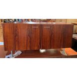 A 1960's Danish style rosewood side cabinet with p