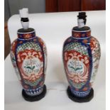 A near pair of Japanese Imari balluster vases now