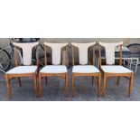 A set of four mid century dining chairs having mou