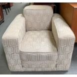 An Art Deco armchair in light upholstery