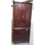 A George III oak floor standing corner cupboard wi