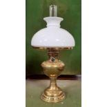 An Edwardian brass oil lamp with white glass shade
