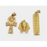 **WITHDRAWN** An Ankh pendant; a mask of Tutankhamun pendant; an