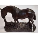 A bronzed resin figure of a carthorse and foal, 15