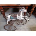 A child's Victorian style horse tricycle, the pain