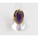 **WITHDRAWN** A single stone amethyst ring stamped ‘18K’, finger