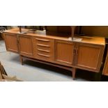 A c.1970's teak sideboard with cupboards and centr