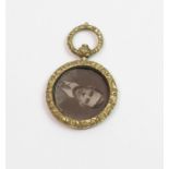 A Victorian gilt metal picture pendant