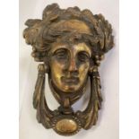Very decorative door knocker in the form of a face