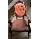 A 20th century mahogany button back open armchair