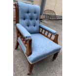 A Victorian stained oak framed open armchair, upho