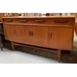 A mid century G Plan sideboard with three drawers