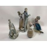 A Lladro porcelain figure of a woman assisting her