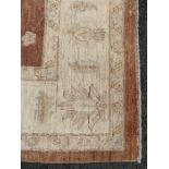 A heavy wool carpet having large central panel of
