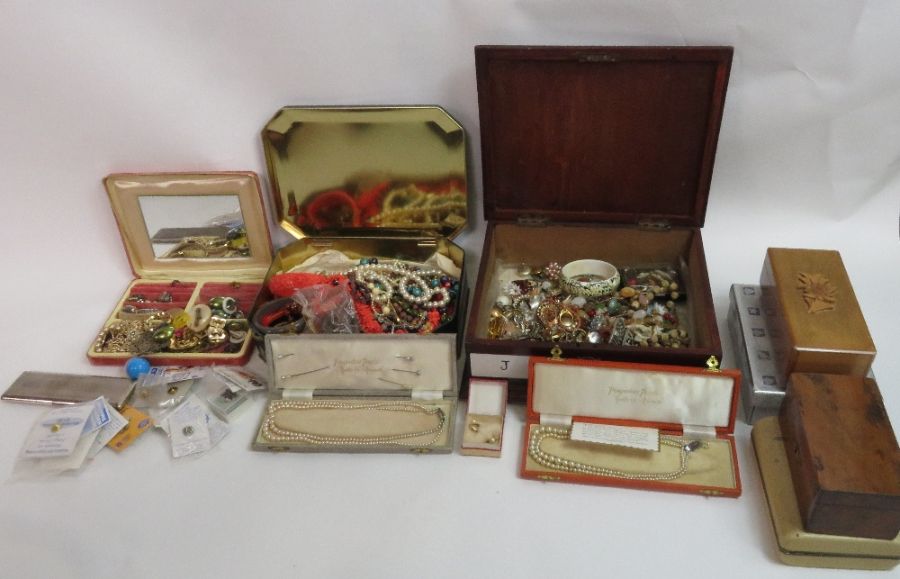 A quantity of costume jewellery, housed in various