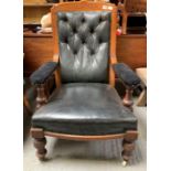 A Victorian open armchair, with stained oak frame,