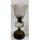 An early 20th century brass oil lamp, black painte
