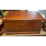 A 20th century mahogany blanket box with brass sw