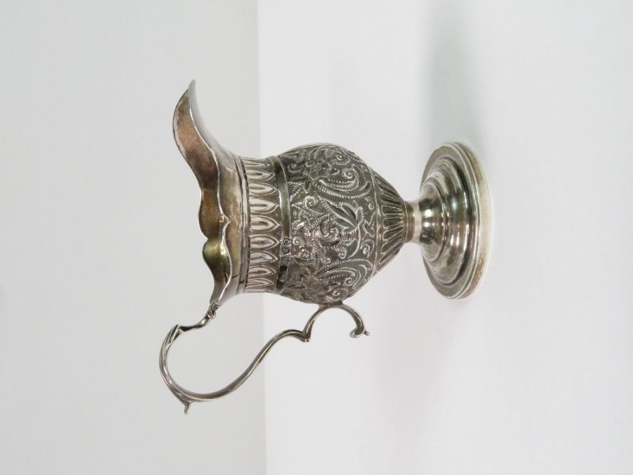 A Victorian silver helmet shaped cream jug, no mak