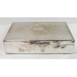 A silver plated cigarette box, wood lined, 16.5